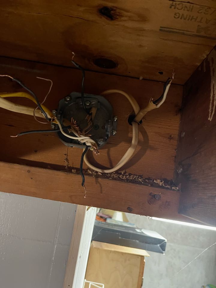 Electrician is repairing a bad junction 