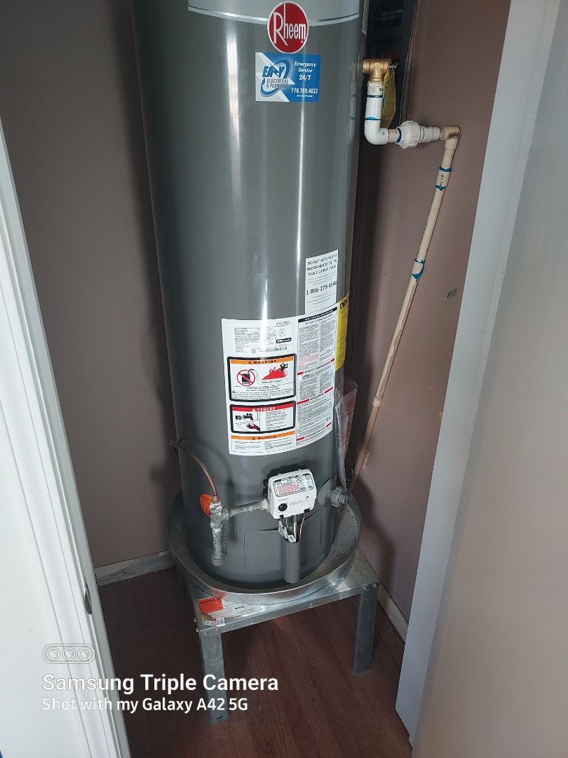 Plumber replacing water heater