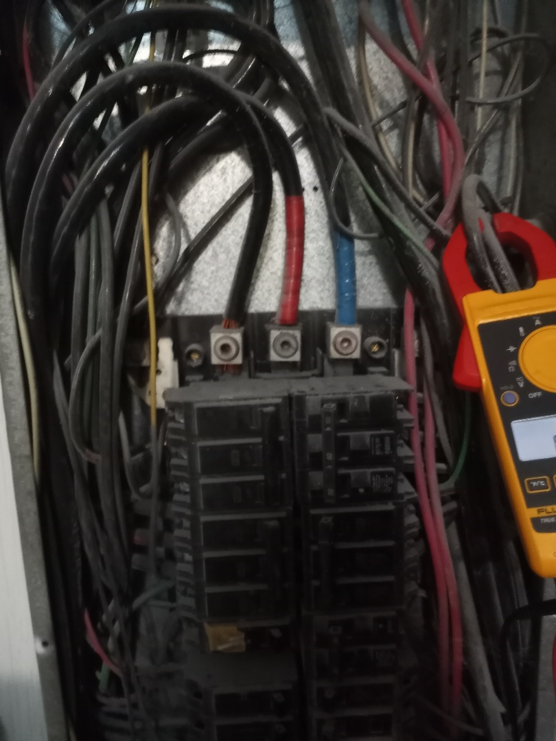 Electrician repairing welder circuit