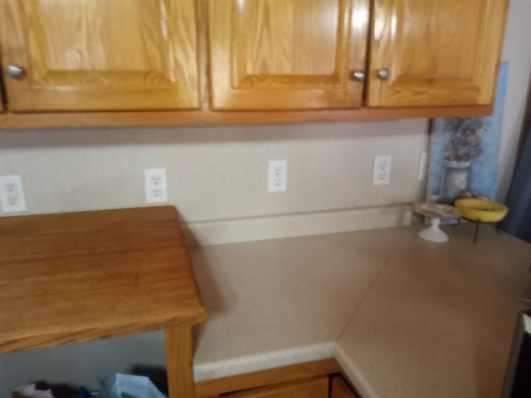 Electrician replacing receptacles