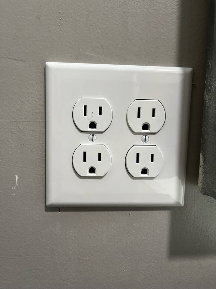 Electrician installing new outlets through out home 