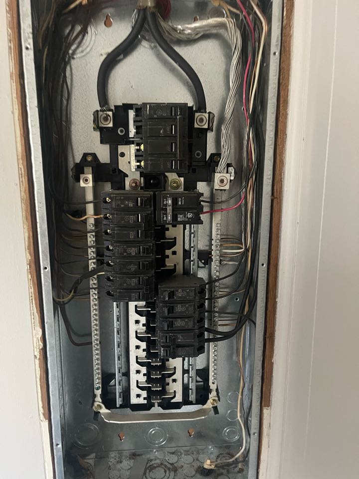 Electrician is replacing a main breaker electrical panel