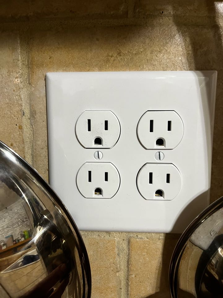 Electrician installing new outlets threw out kitchen 