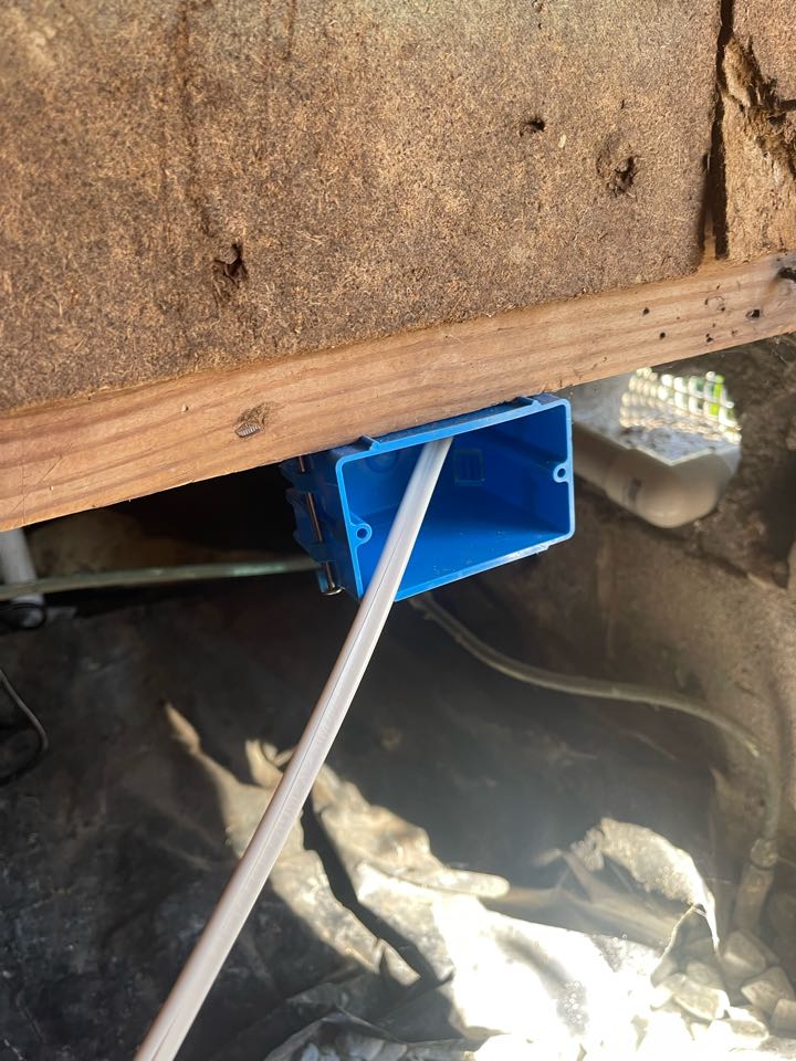 Electrician is adding a outlet in crawlspace for a new sump pump install