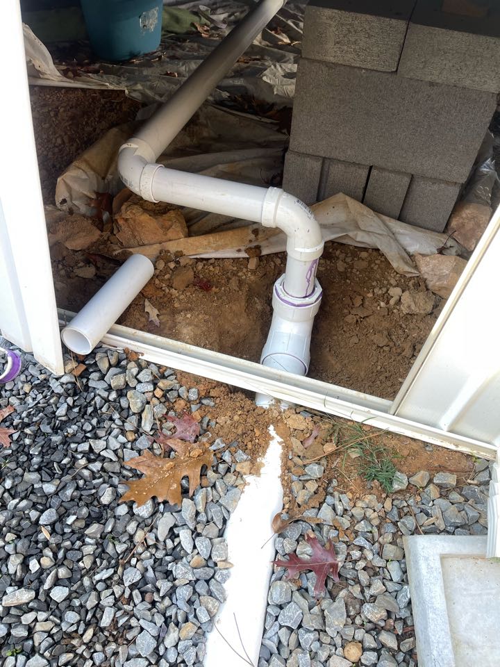 Plumber installing new drain line 