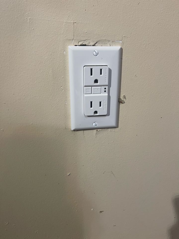 Electrician is replacing old gfcis through out home 