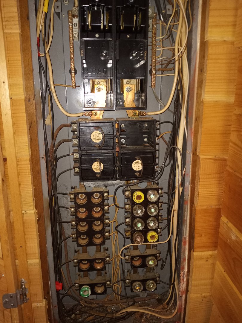 Electrician replacing old fuse box