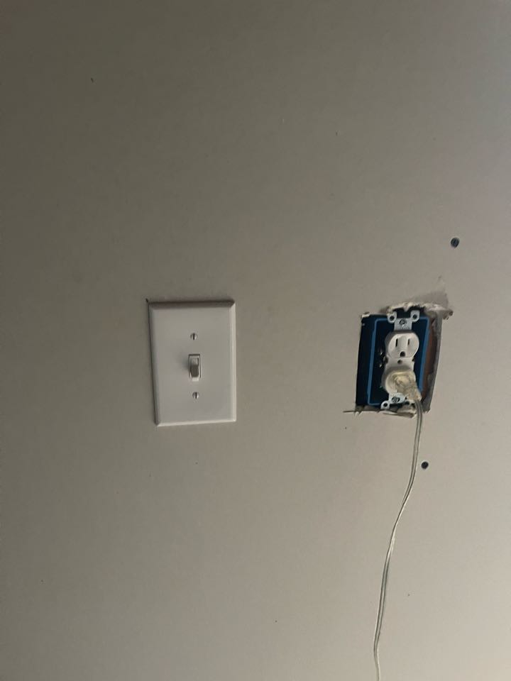 Electrician is installing new switches on existing electrical wiring 