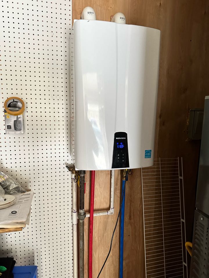 Plumber in Armuchee is repairing water heater tankless system to home