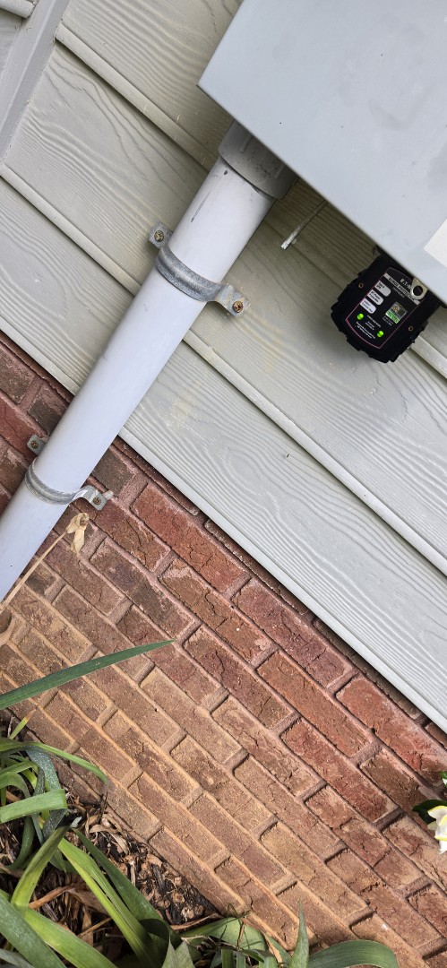 Electricians installing whole home surge protection
