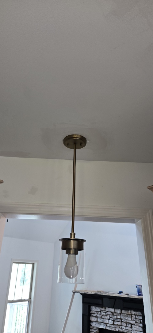 Electrician correcting taps and light fixtures
