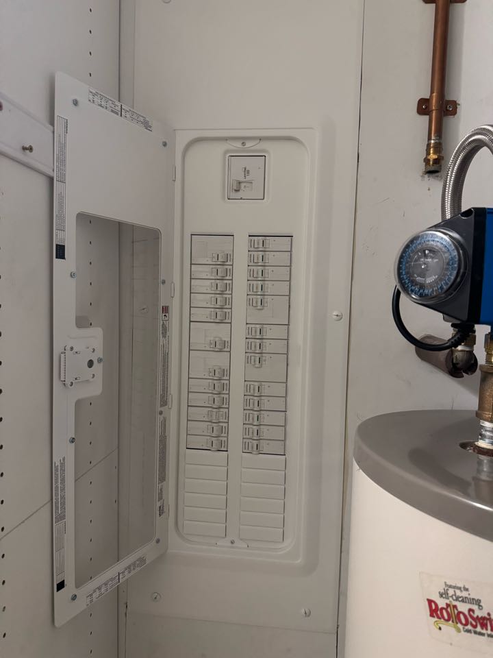 Electrician installing panel. 