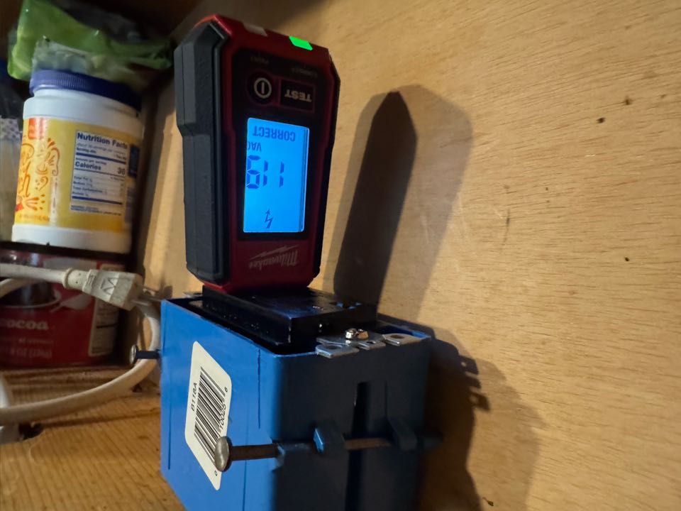 Electrician installing microwave plug. 