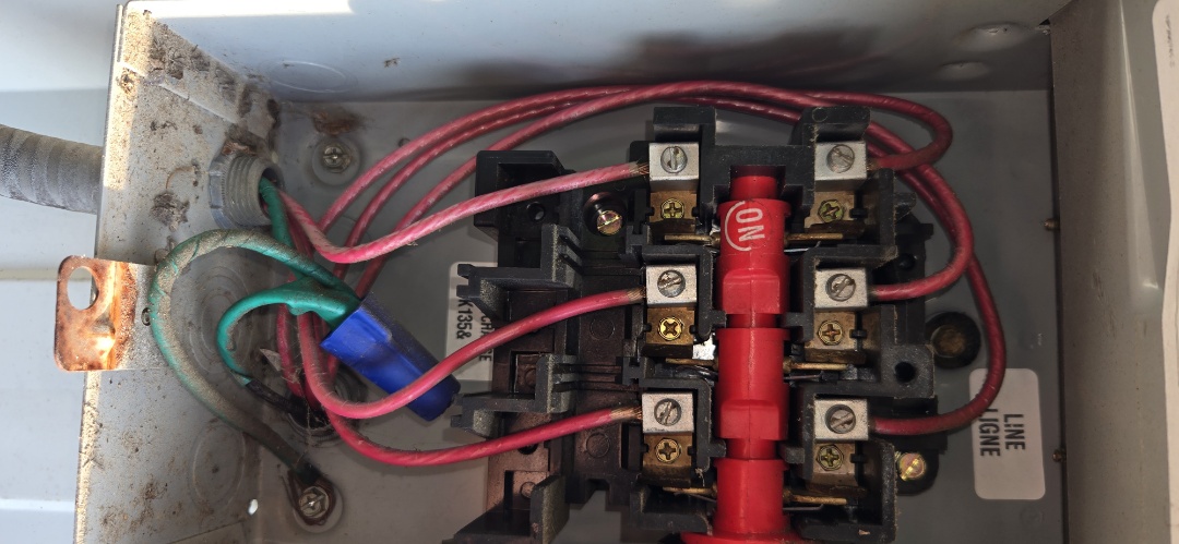 Electricians troubleshooting electrical contactor