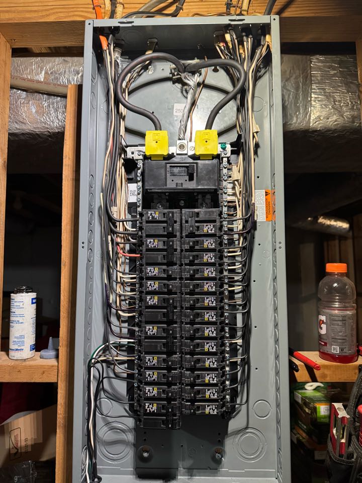 Electrician installing new panel