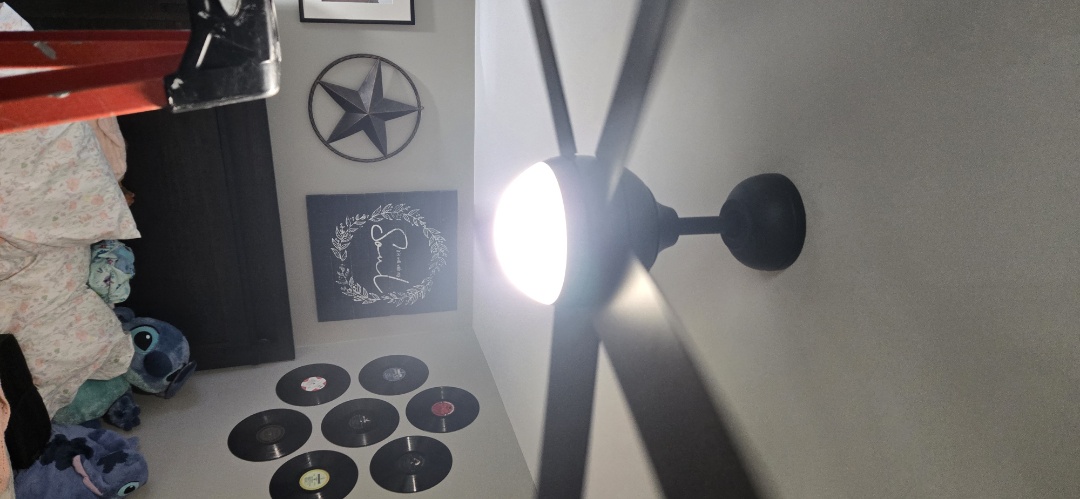 Electrician installing fan