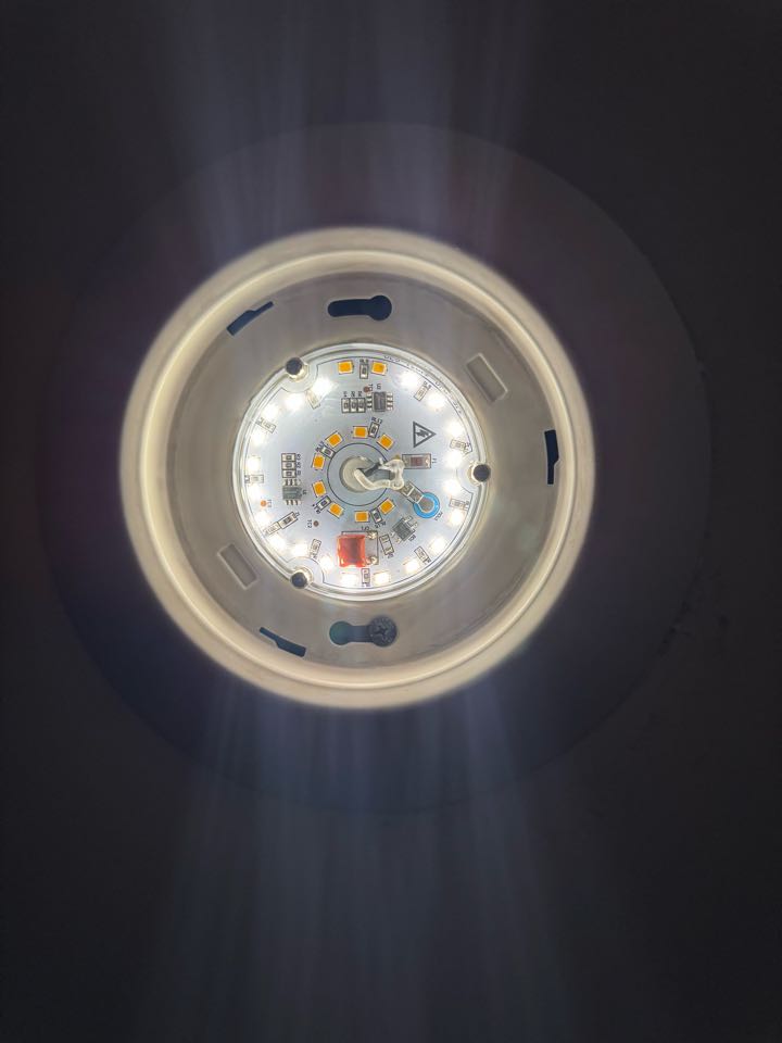 Electrician replacing light fixture