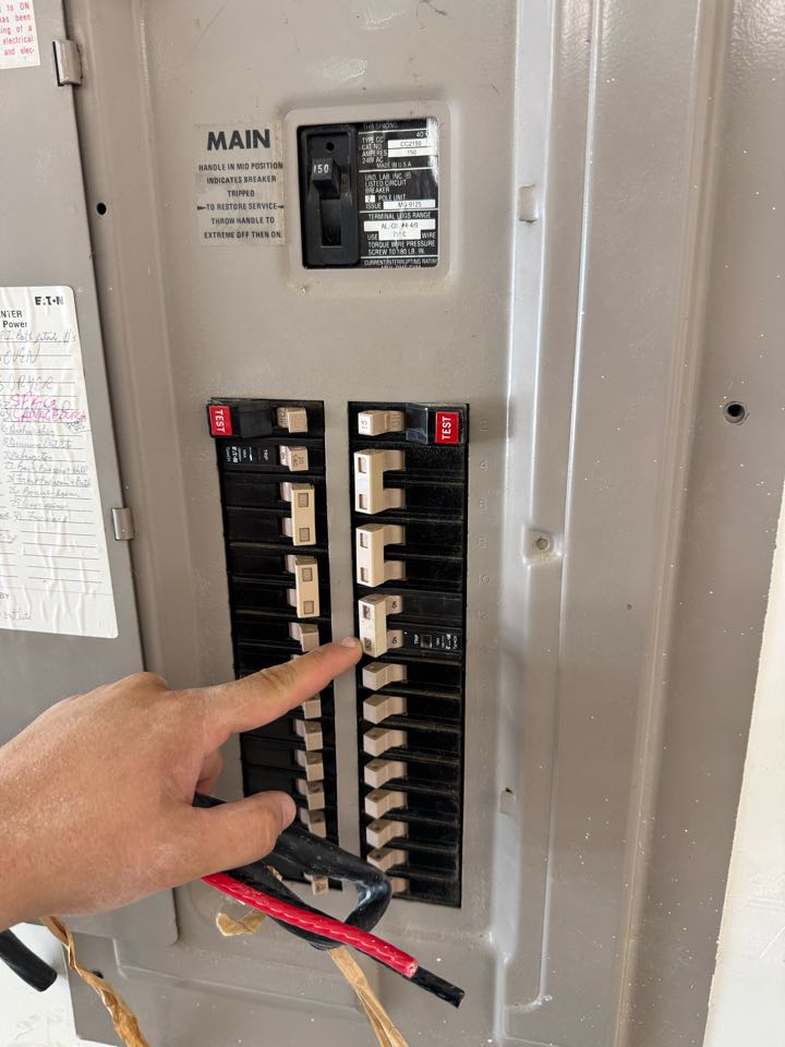 Electrician installing 50 amp circuit for EV charger plug. 