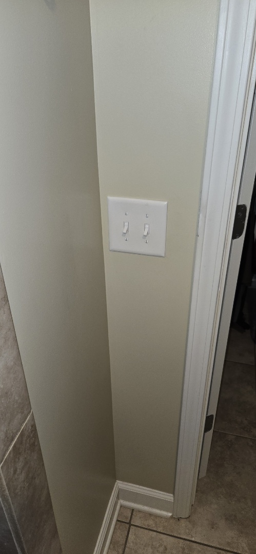 Electrician installing  switches