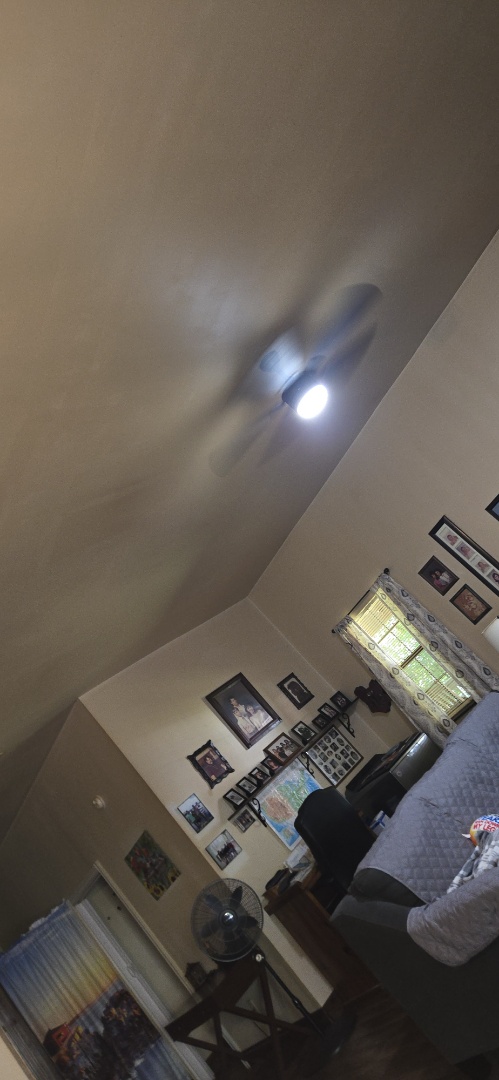 Electrician installing fan 