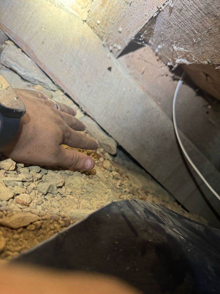 Electrician wiring in knee crawl. 