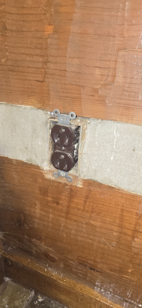 Electrician installing to new outlets