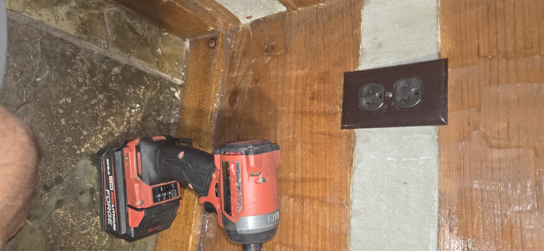 Electrician installing to new outlets