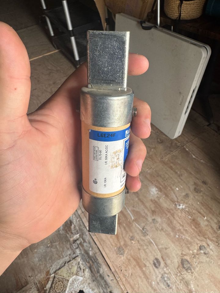 Electrician replacing fuses. 