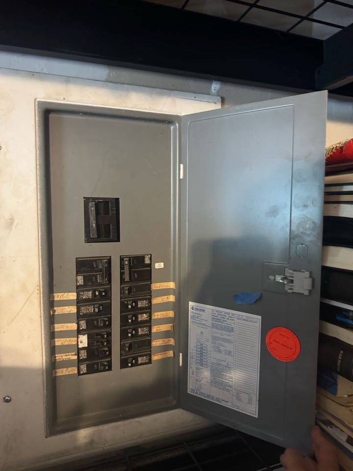 Electrician replacing panel. 