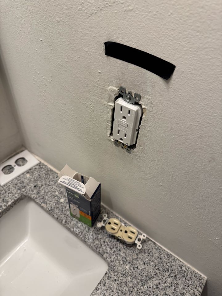 Electrician replacing outlets. 