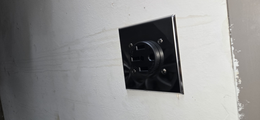Electrician installing a nema 14/50r outlet 