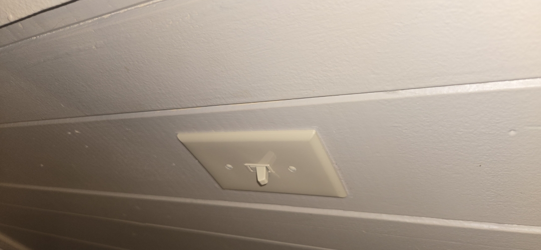 Electrician replacing broken device