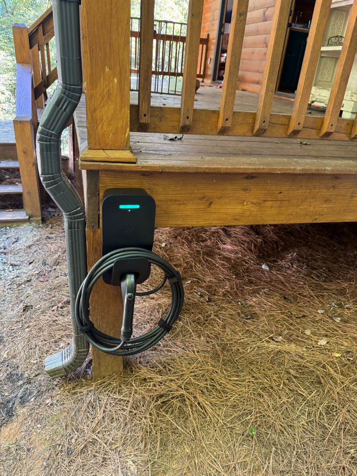 Electrician installing car charger. 