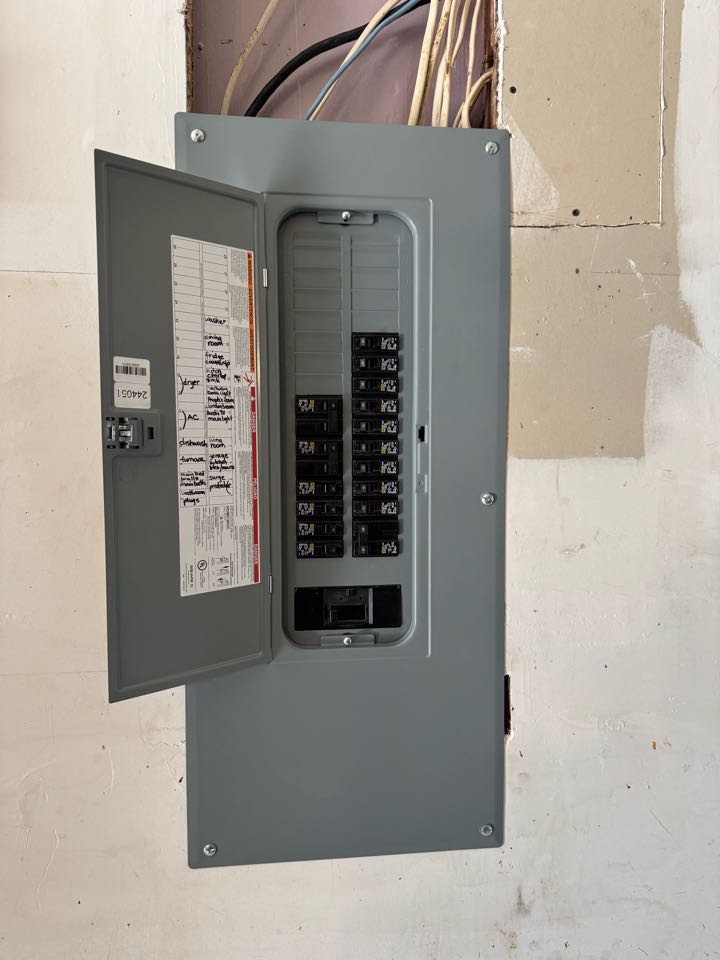 Electrician replacing breaker box