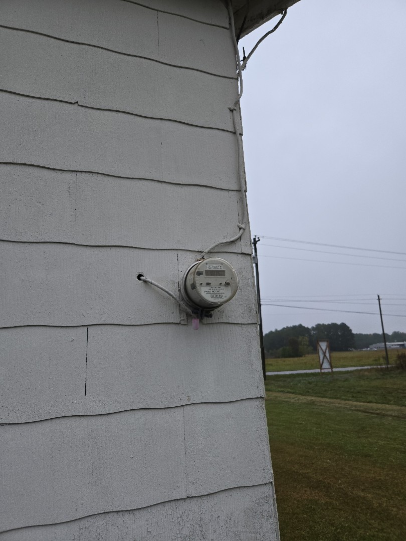 Electrician is giving a free electrical estimate for service upgrade. Electrician is giving a free electrical estimate for service upgrade.