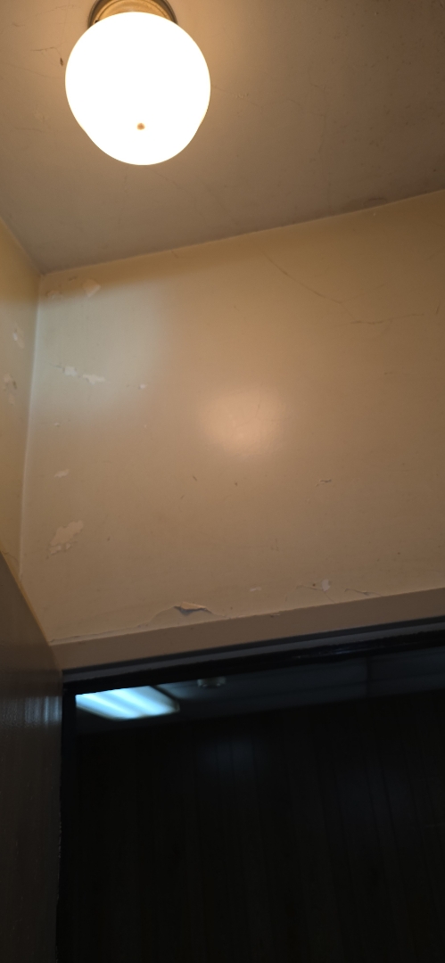 Electrician, inspecting customer supplied lights for future install