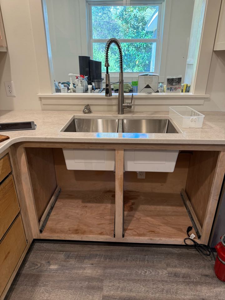 Put in kitchen sink faucet and drain  Put in kitchen sink faucet and drain