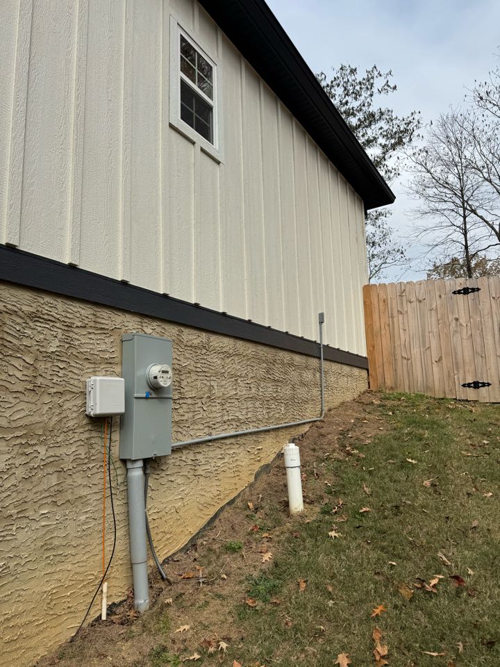 Electrician is installing a new outdoor circuit 