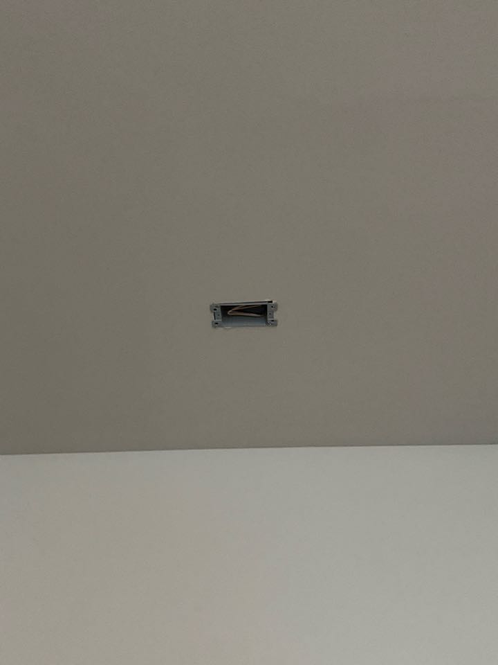 Electrician is installing a new lighting outlet 