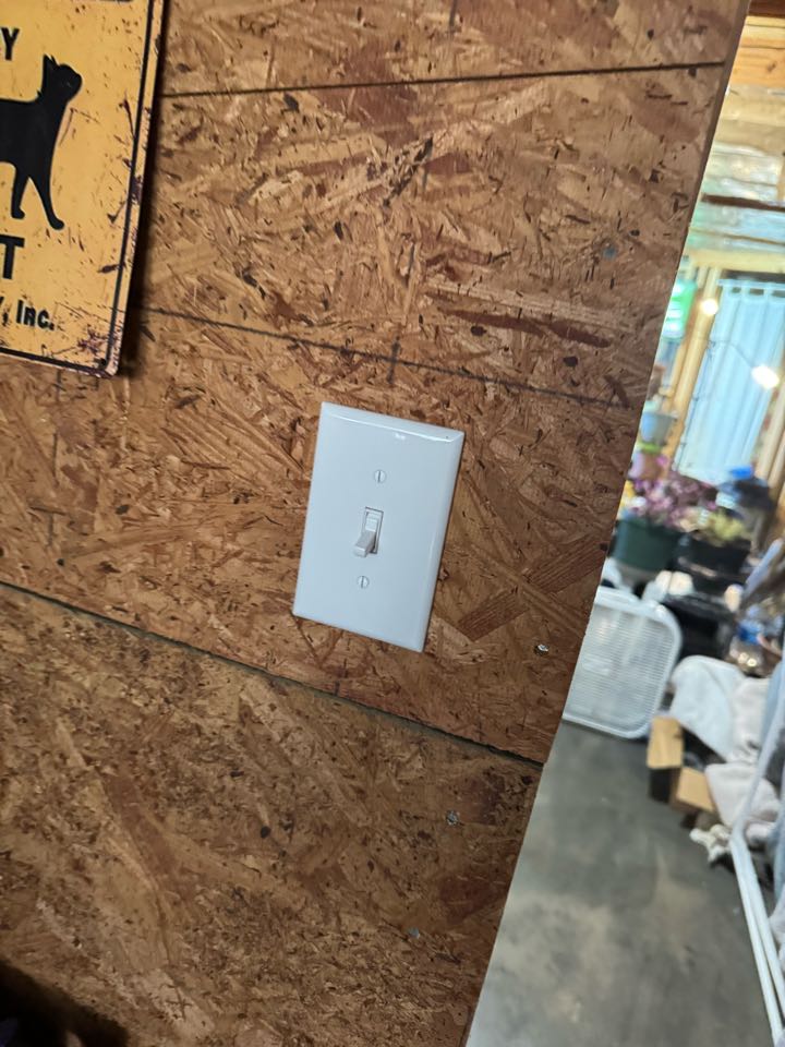 Electrician is installing a new light switch 