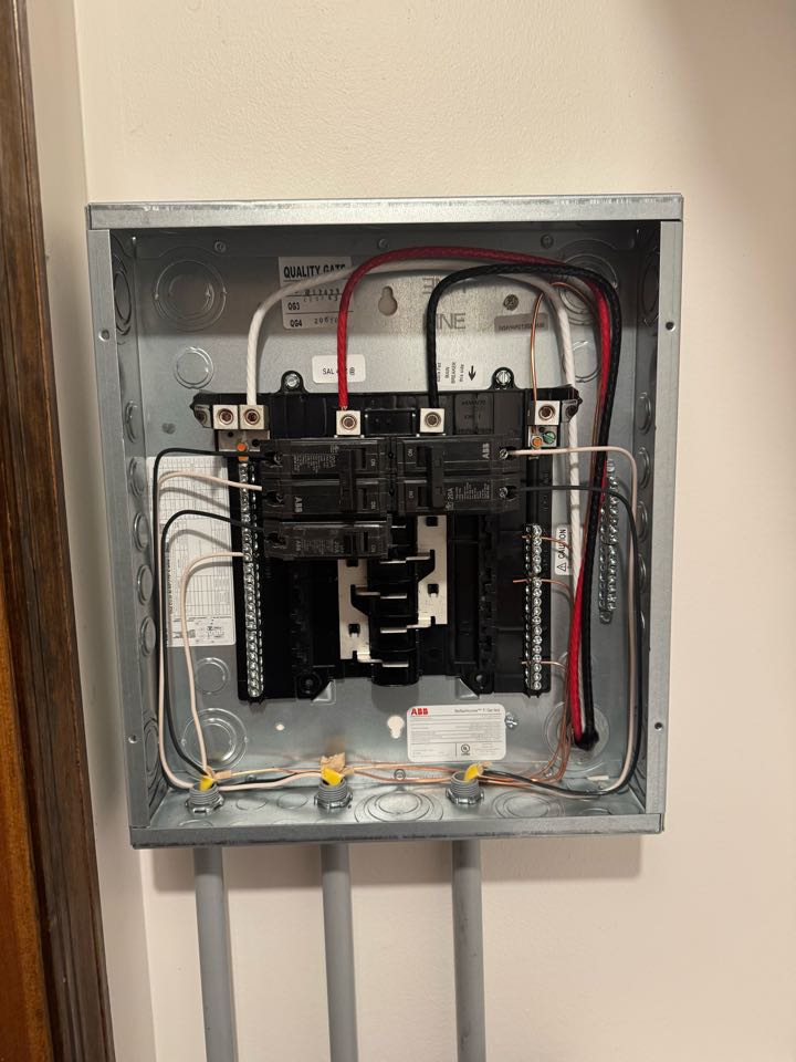 Electrician is installing a new sub panel