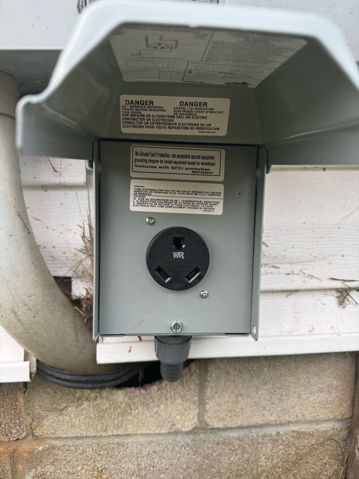 Electrician is installing a 120v camper outlet