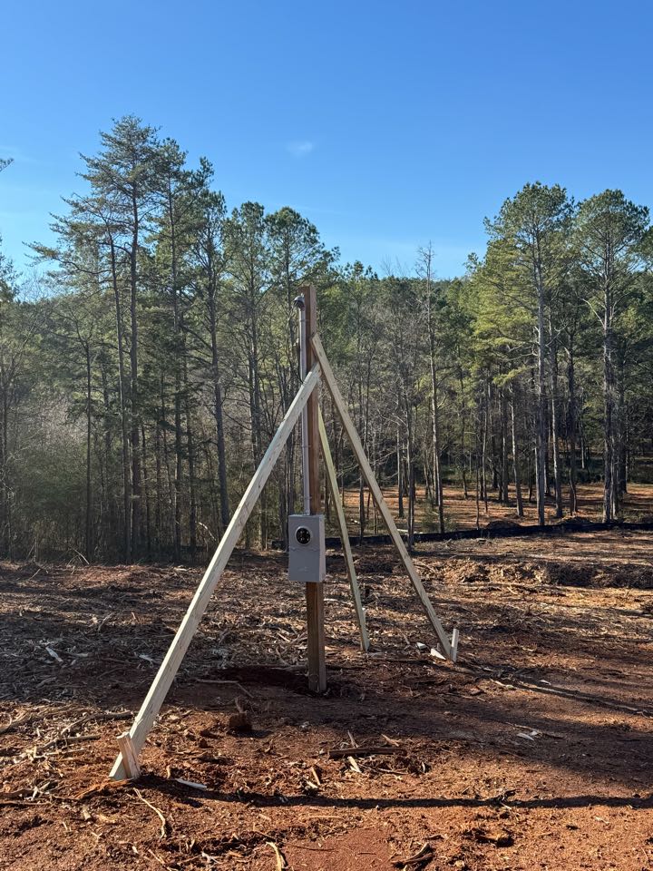 Electrician is installing a new 100 amp temp pole 