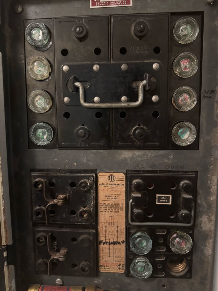 Electrician is replacing a fuse panel 