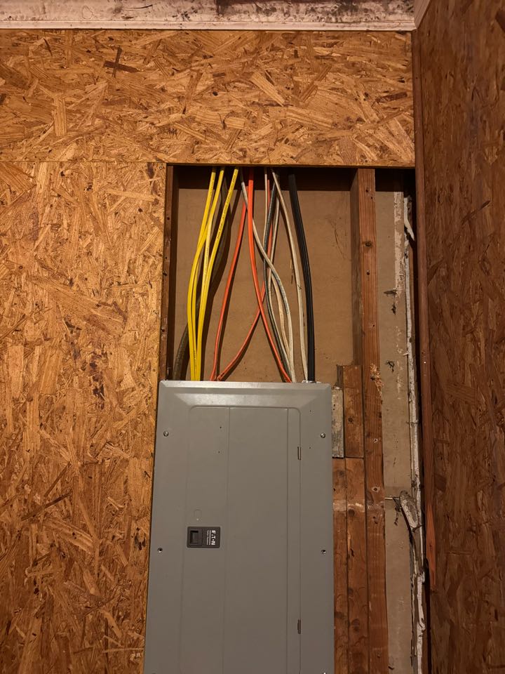 Electrician is replacing a panel 
