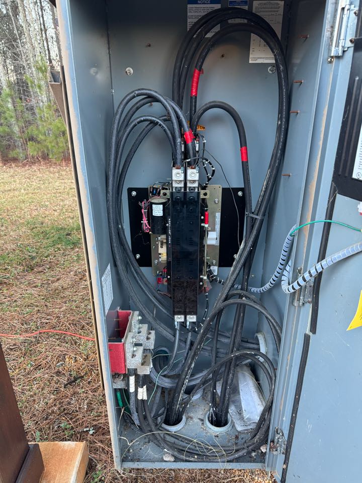 Electrician is installing a new transfer switch 