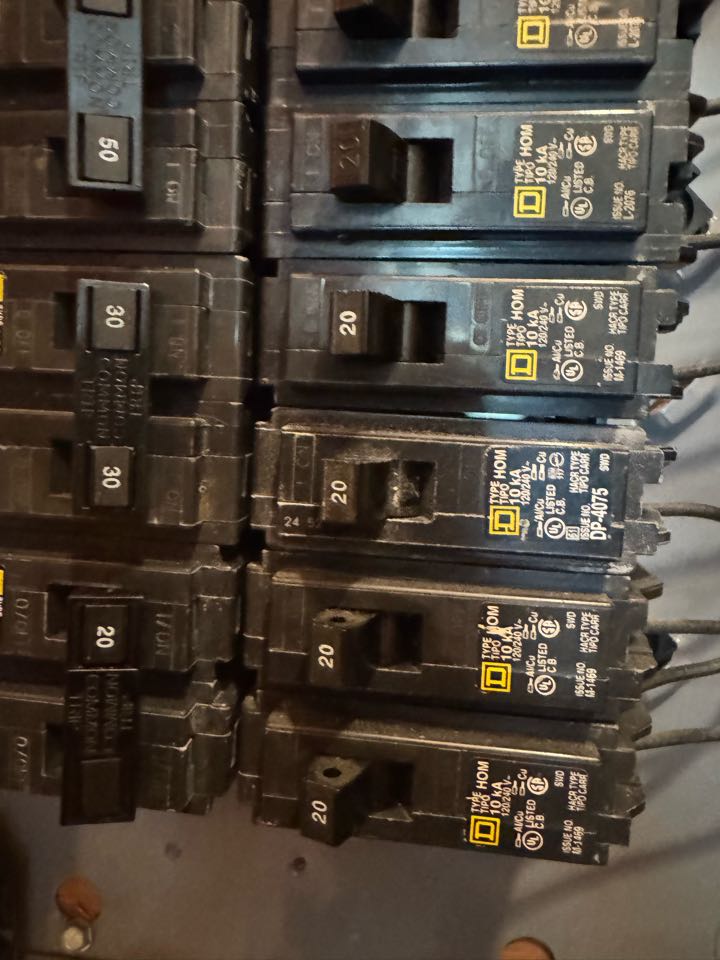 Electrician is installing a new breaker 