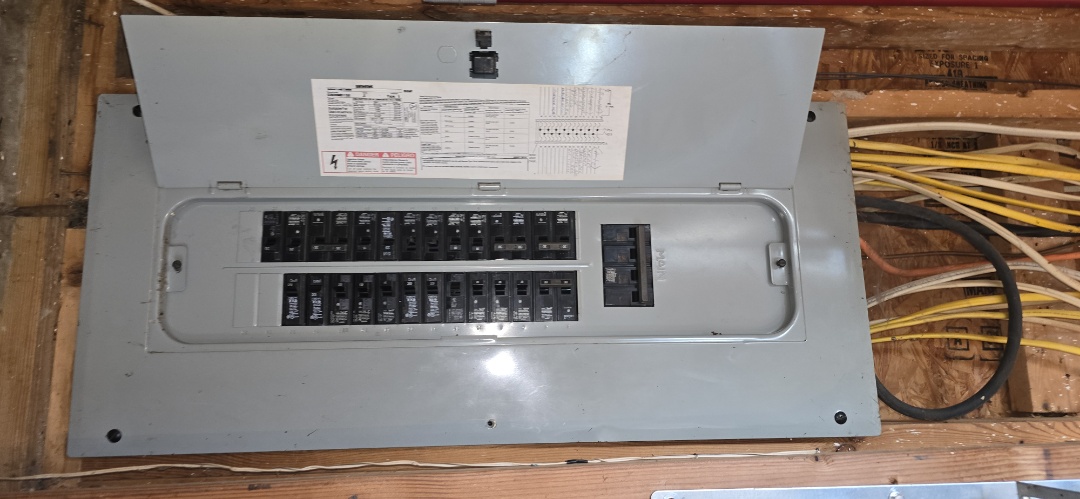 Electrician completing panel inspection