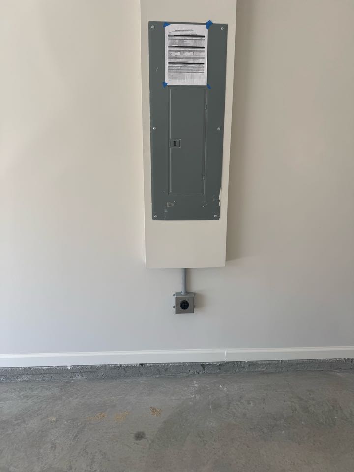 Electrician is installing a new ev outlet in garage 