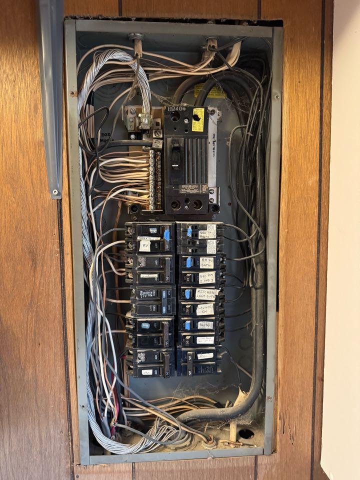 Electrician is replacing a old panel 